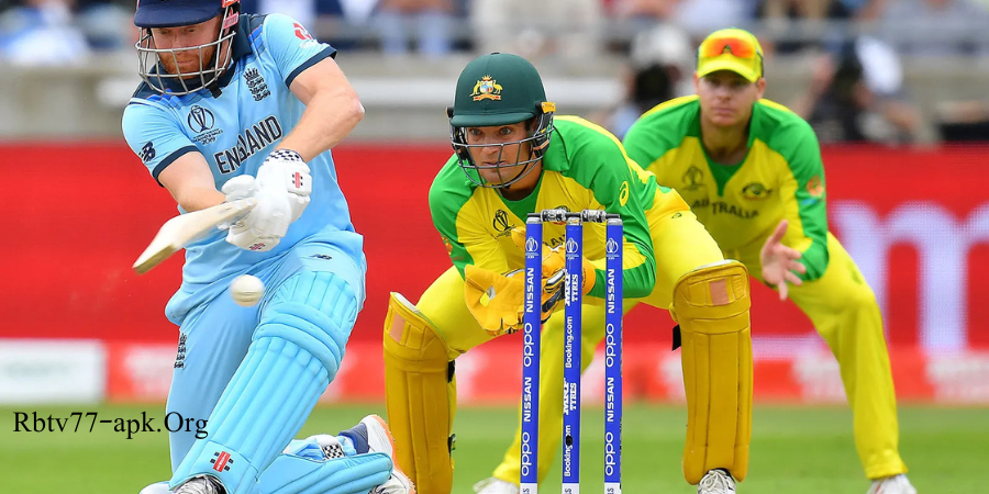 England batsman in light blue kit playing a shot as Australian wicketkeeper and fielder in yellow and green uniforms prepare to field during an international cricket match — Rbtv77-apk.org.